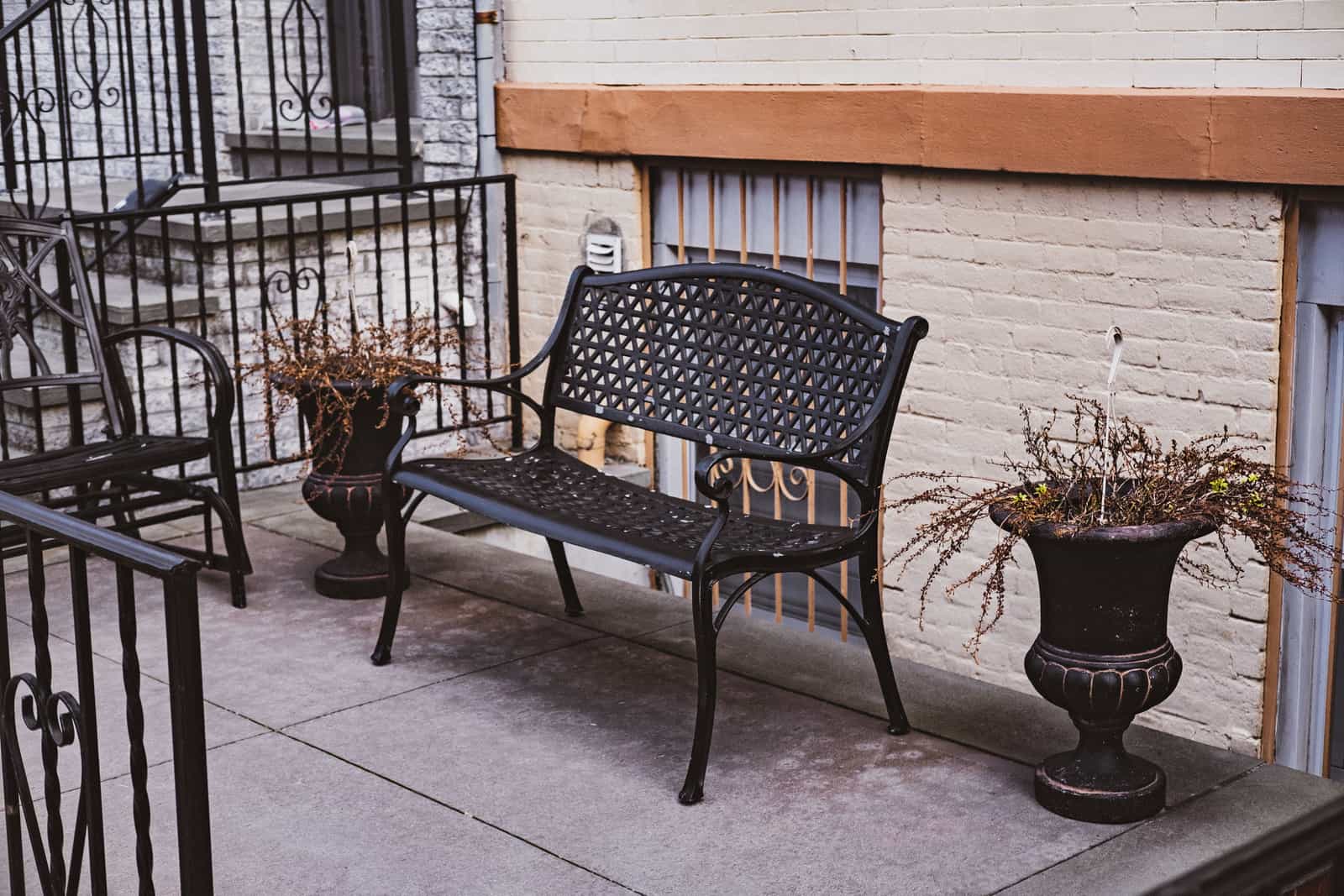 Metal patio furniture on a bright terrace
