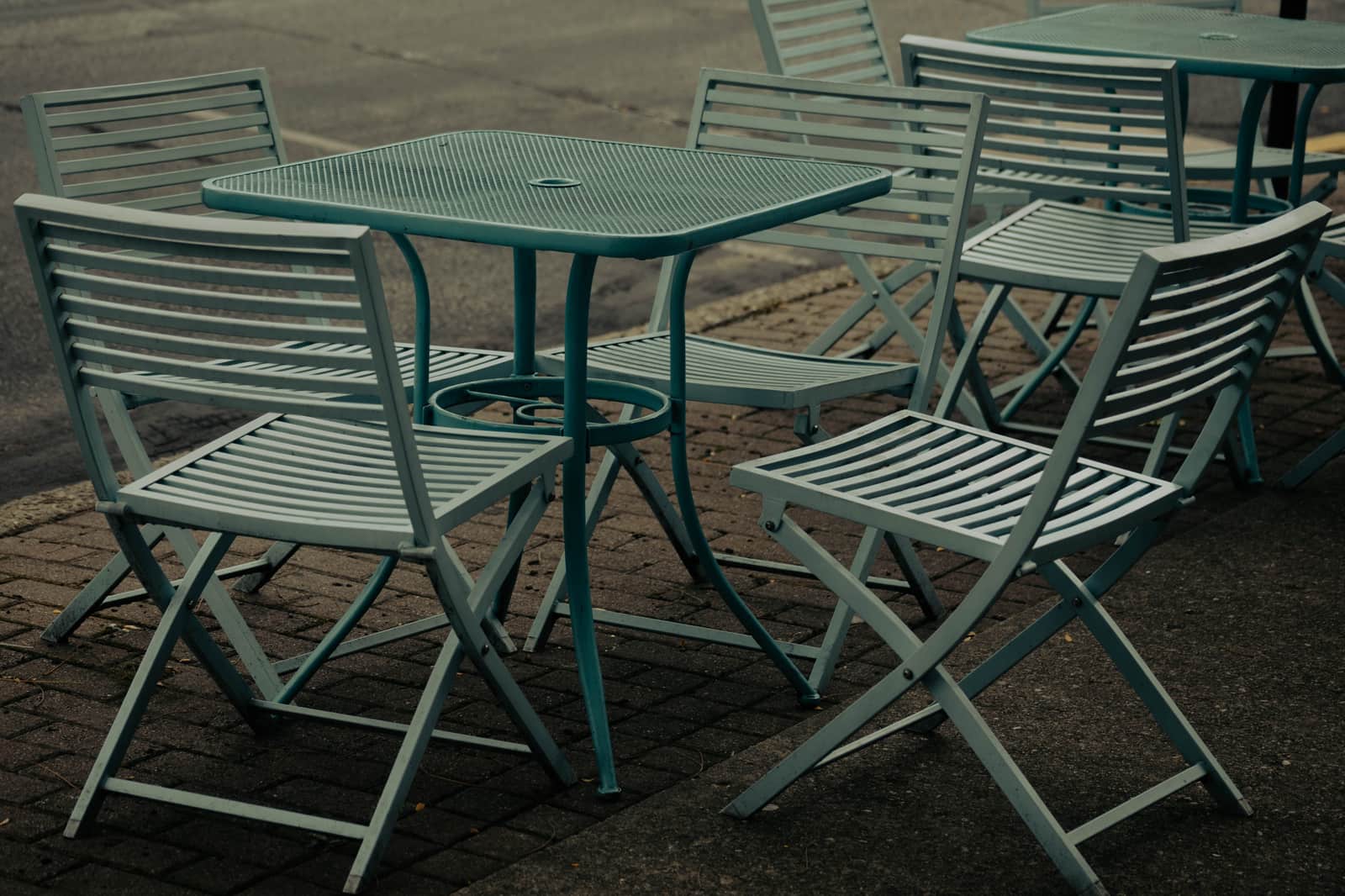 An outdoor dining table and chairs on a patio