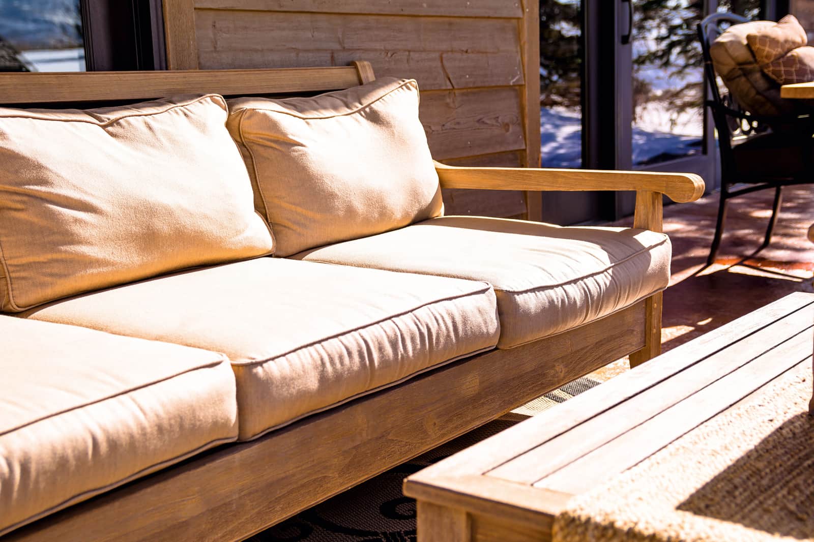 An outdoor sectional sofa with cushions on a terrace