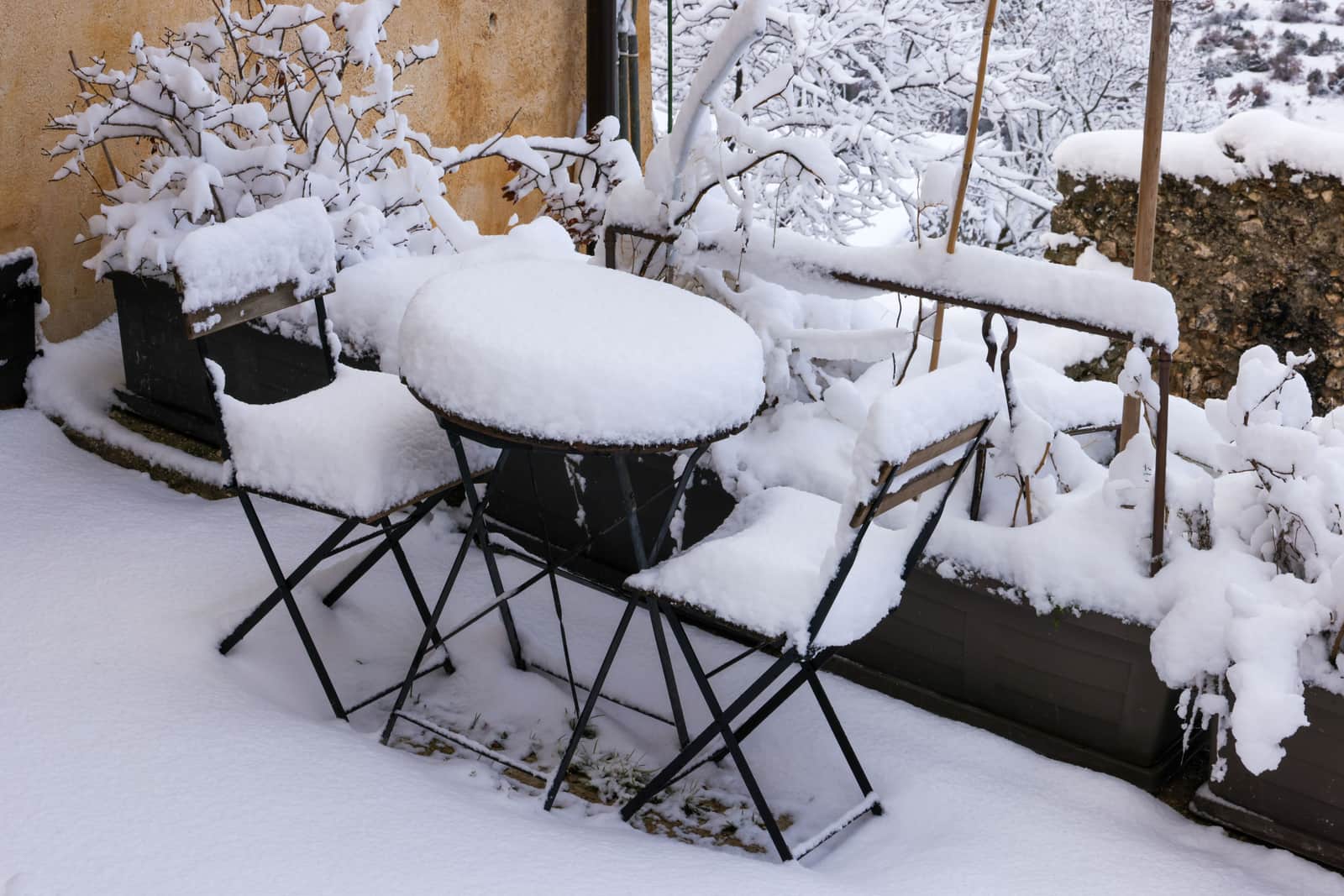 Garden furniture standing in cold wet weather