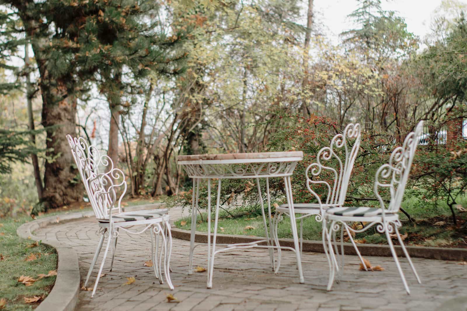 An ornate wrought iron garden chair