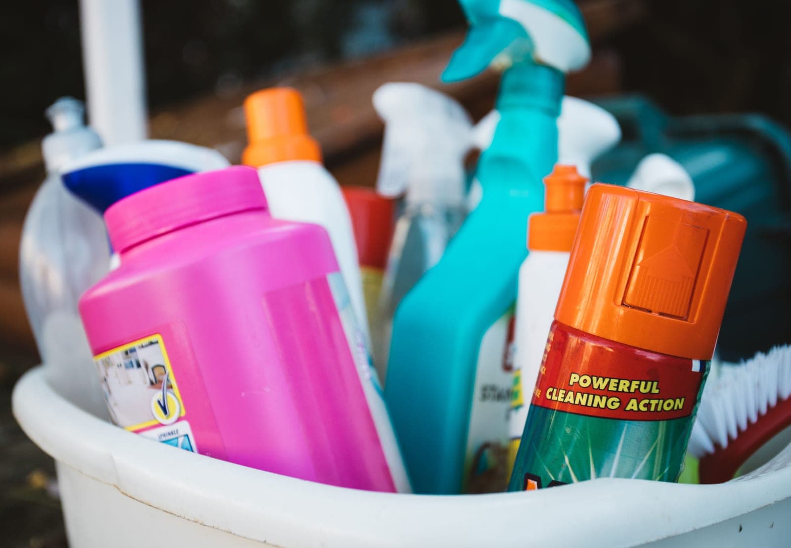 Teak cleaning products beside a weathered teak chair