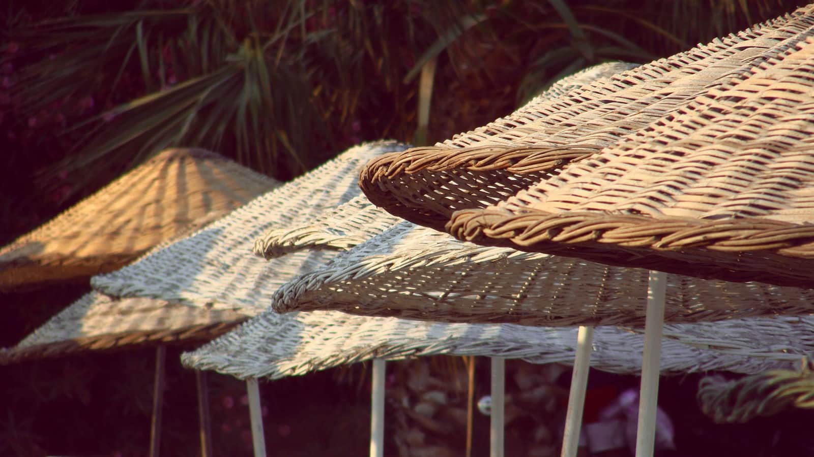 Large rectangular cantilever umbrella over an outdoor sofa